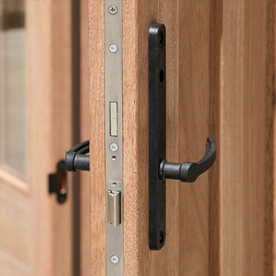 Multipoint locking system professionally installed on a solid wooden door to improve entryway security and durability