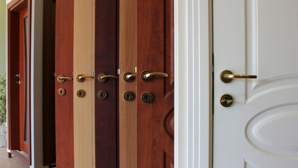 Variety of front door options for Winnipeg homes, featuring wood and steel finishes, secure locks, and modern entry door styles.