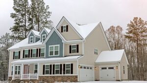 Modern Winnipeg home in winter covered in snow, showing well-sealed windows and doors, an example of How to Winterize Windows and Doors effectively.